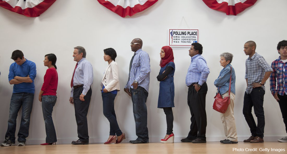 Voters waiting to vote in polling place